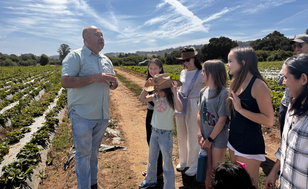 Javier Zamora of JSM Organics leading a farm tour through organic strawberry fields in Watsonville California