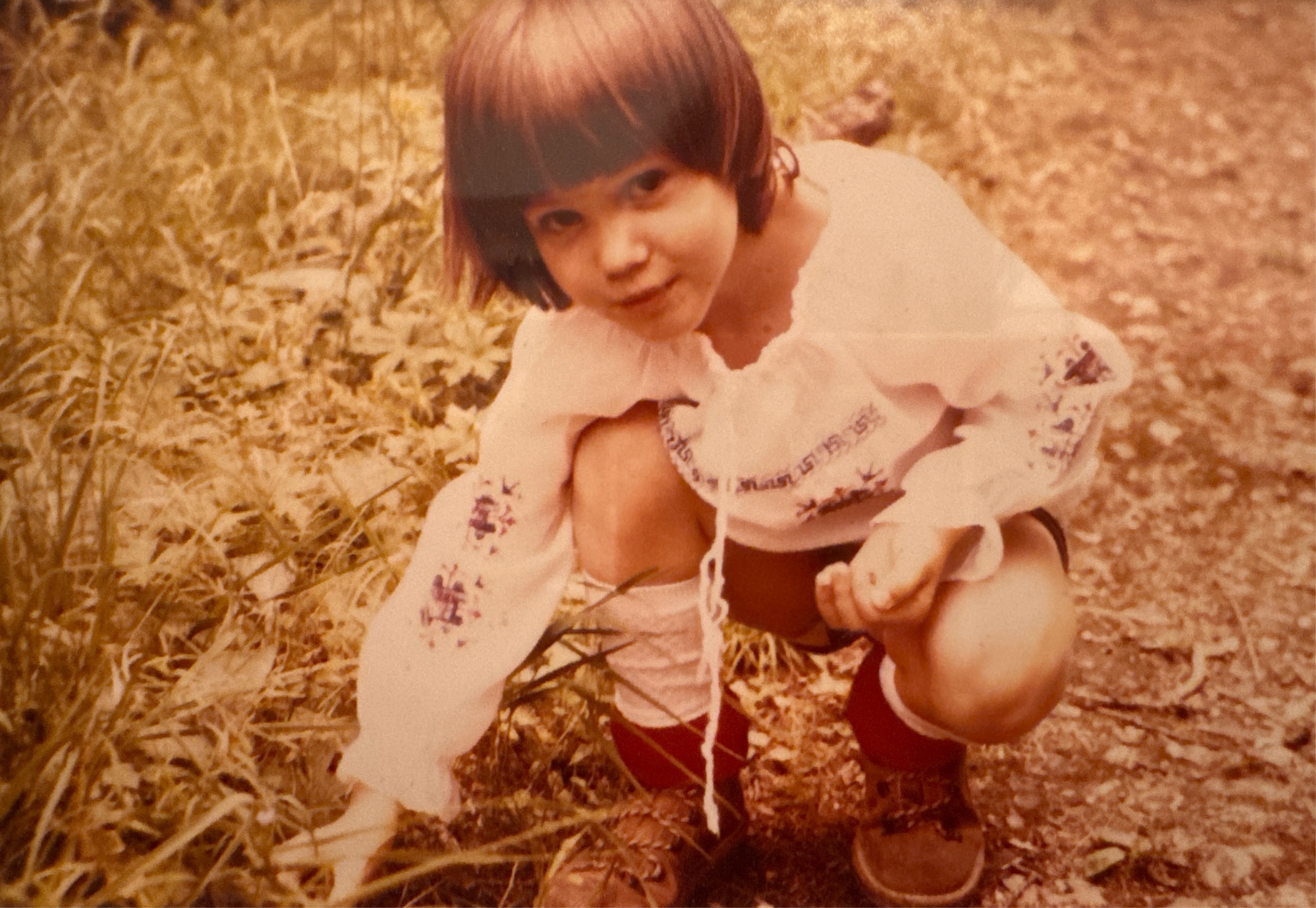 Julia Sunderland founder of Rootstock picking fresh wild strawberries as a child